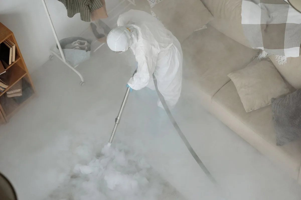 Biohazard cleanup technician in protective equipment, McAdoo, PA